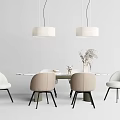 Minimalist Dining Table Set With Light Colored Chairs Hanging Pendant Lights And Vase With Plants