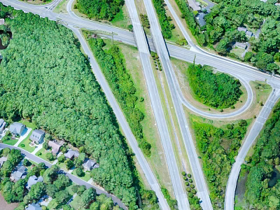 Aerial View Of Highway Bridge With Green Trees Road Intersections Residential Areas And Curved Ramps 3d model