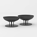 Two Black Ceramic Vessels With Modern Minimalist Design And Pedestal Base