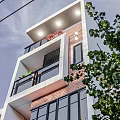 Three Story Single Family House With Red Brick White Wall On Tree Lined Street