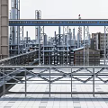 Large Industrial Factory With Steel Structures Pipes Rooftop Platforms And Buildings