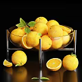 Fresh Oranges in Glass Bowl with Slices and Green Leaves on Black Surface