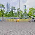 Urban Entrance Gate With Transparent Glass Pavilions Yellow Barriers Surrounding Trees And Distant Tall Buildings