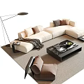 Beige L Shaped Sofa And Black Coffee Table Set With Cushions Throw Blanket And Books