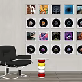 Neatly Arranged Digital Smartphones Wall Display With Accessories Near Leather Chair