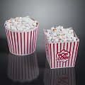 Delicious Freshly Popped Popcorn in Red and White Striped Paper Buckets on Black Surface