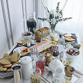 Delicious Breakfast Spread On Table With Bread Fruit Bowls Teapot Coffee Cups And Pancakes