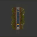 Yellow and blue train on railway tracks with green vegetation utility poles and signal signs