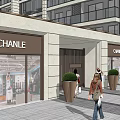 Modern Building Outdoor Shopping Area With Storefronts Seating Umbrellas Green Planters And Pedestrians