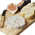 Fresh Figs Sliced Cheese and Bread on Wooden Cutting Board with Knife