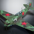 Green Camouflage Military Model Airplane With Red Stars And Propeller