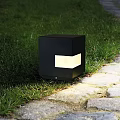Modern Black Cube Shaped Outdoor Light Illuminating Garden Grass And Stone Path