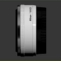 LUMIX Black And White Camera Lenses 25mm F1.7 ASPH Displayed On Reflective Surface
