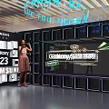 Mobile Digital Products Showcase In Modern Gift Box Shaped Booth With Black Ribbon Bow