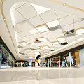 Modern White Suspended Ceiling With Recessed Lighting And Geometric Panels In Commercial Space