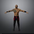 Shirtless Man With Tattoos In Black And Red Wrestling Pants Standing With Arms Outstretched