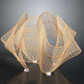 Golden Wireframe Sculpture With Curved Geometric Design And Metal Mesh Structure