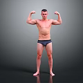 A Man Flexing Muscles Shirtless In Dark Underwear Standing Against Gray Background