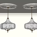 Two Elegant Chandeliers With Cream And Floral Shades Hanging From White Ceiling Medallions