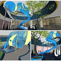 Indoor Playground Space With Blue Spiral Slide Yellow Accents Trees And Open Design