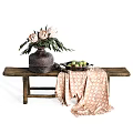Rustic Ceramic Vase With Protea Flowers On Wooden Bench With Patterned Cloth And Fruit Plate