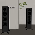 Modern Floor Standing Speakers With White Cylindrical Background And Green Plants