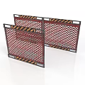 Multiple Red Metal Mesh Safety Barriers With Black Yellow Warning Stripes