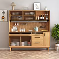 Modern Wooden Sideboard In Dining Room With Glassware Bottles And Green Plant Decor