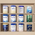 Decorative Ornament Combination Featuring Aptamil Milk Powder Cans On Three Tiered Shelf