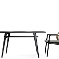 Modern Dining Table Set With Wicker Back Chairs And Black Sleek Tabletop Design 3d model