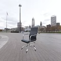 Modern Black Office Chair With Silver Metal Armrests And Swivel Caster Wheels