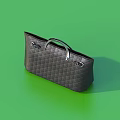 Dark Gray Quilted Handbag With Silver Metal Hardware On Green Background