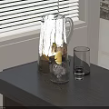 Clear Glass with Lemon Slice Ice and Empty Glass on Gray Table Near Window Blinds