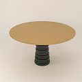 Round Dining Table With Gold Tabletop And Black Spiral Stacked Leg Design