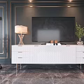 Elegant White TV Stand with Drawers Lamp Green Plant and Dark Wall Gold Trim