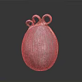 Metallic Textured Oval Household Item With Two Ring Decorations On Top