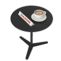 Black Round Coffee Table With Two Coffee Cups White Saucers Books And Pinecone Bowl