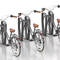 Classic Bicycles Parked at Bike Racks With Gray Frames and Brown Seats