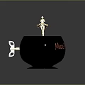 Black Decorative Candle Holder With Golden Figurine Top And Red Alone Text