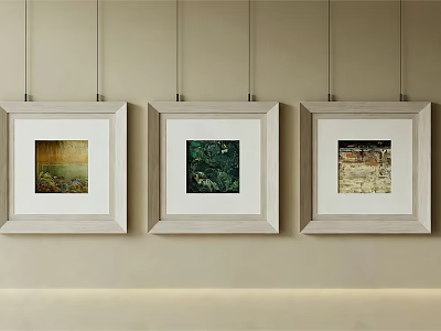 Three Abstract Paintings In White Frames Hanging On Beige Wall 3d model