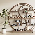 Traditional Chinese Circular Display Shelf With Decorative Items And Green Plant