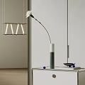 Elegant White Carnation in White and Green Vase on White Cabinet with Blue Items and Hanging Lamp