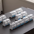 White Multiple Switch Panels Placed On Dark Wooden Table With Gray Wall Background