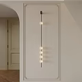 Modern Wall Light With Black Elongated Rod And Multiple Round Bulbs On White Minimalist Wall