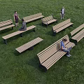 Multiple Wooden Landscape Seats On Green Grassland With People Resting And Walking