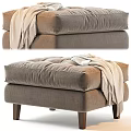 Cozy Taupe Ottoman With Tufted Cushion Soft Blanket And Wooden Legs