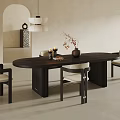 Minimalist Oval Dark Wood Dining Table Set With Upholstered Chairs Pendant Light And Decorative Vase