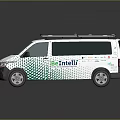 White Volkswagen Van With Green And Blue Pattern Roof Rack And AmeiLin Logo