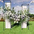 Floral Installation With Black Frame Columns White Lavender Flowers Circular Decorations On Green Grassland