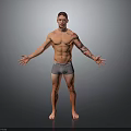 Shirtless Man With Arm Tattoos Standing In Gray Shorts And Arms Outstretched Against Gray Background